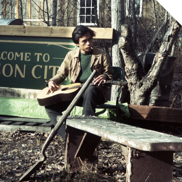 Ramon playing guitar at home in Dawson City, Yukon 