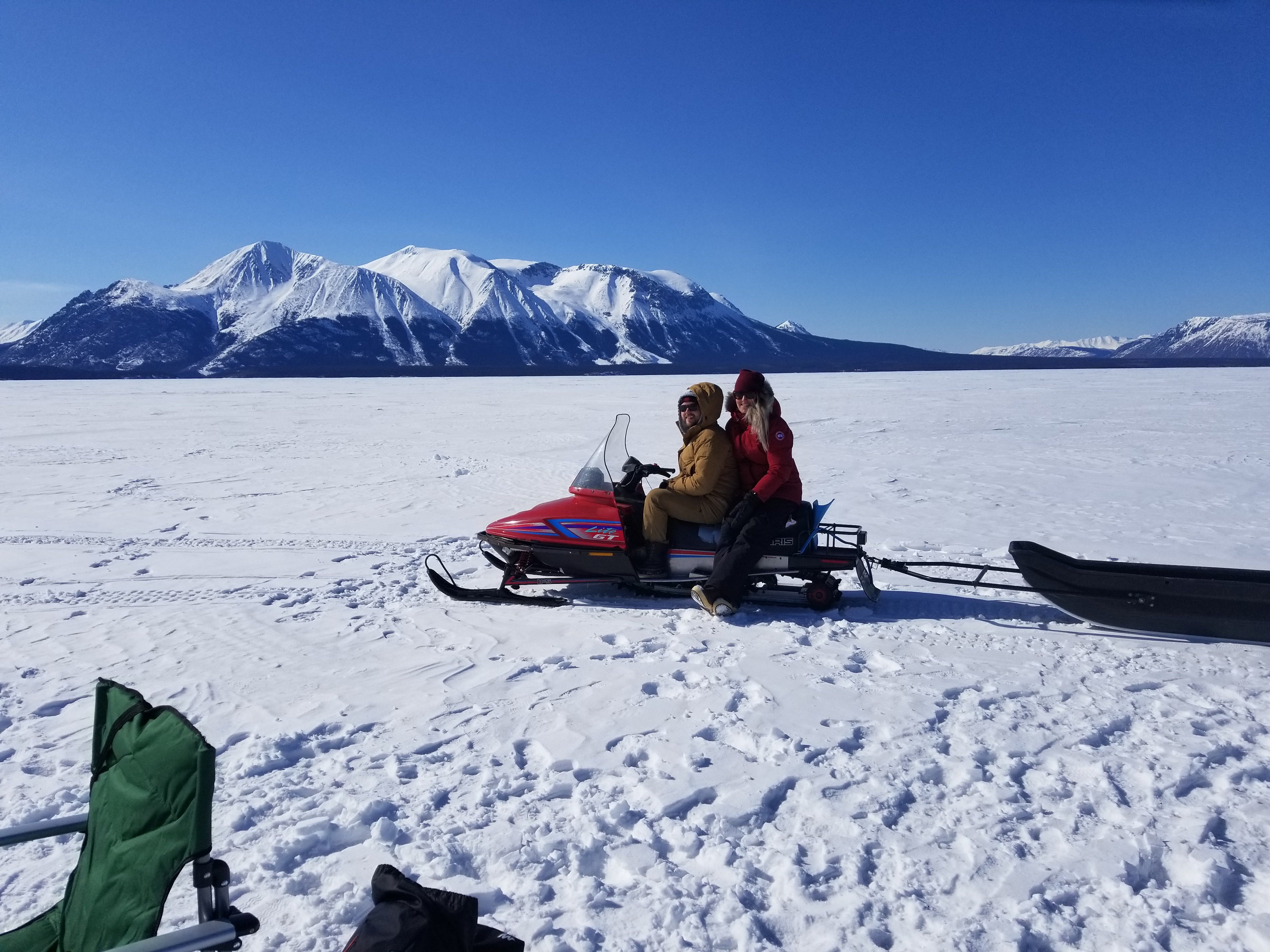 Jeff on a snowmobile on Atlin Lake