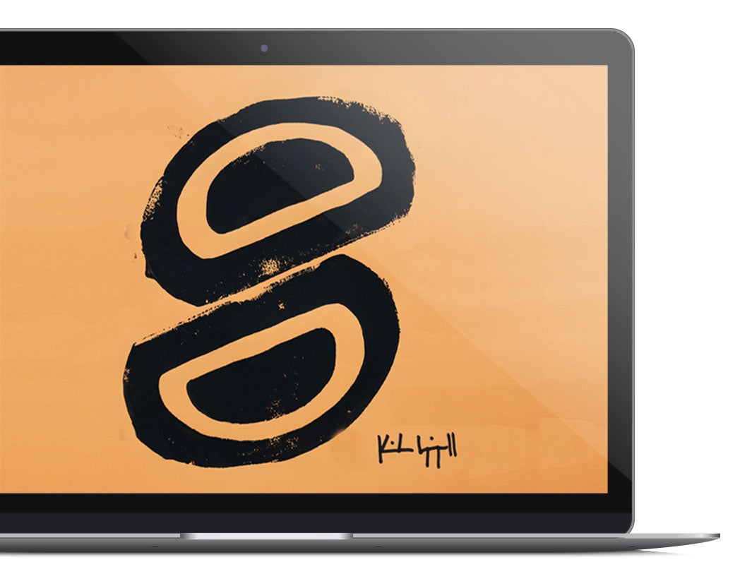 Laptop with orange shirt artwork