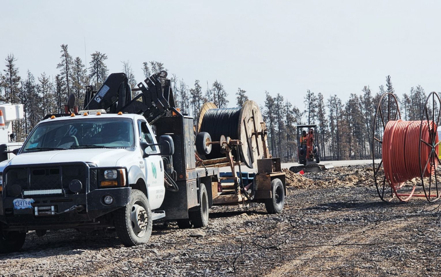 Northwestel technicians working to repair fibre in NWT truck on telecommunication worksite in the NWT