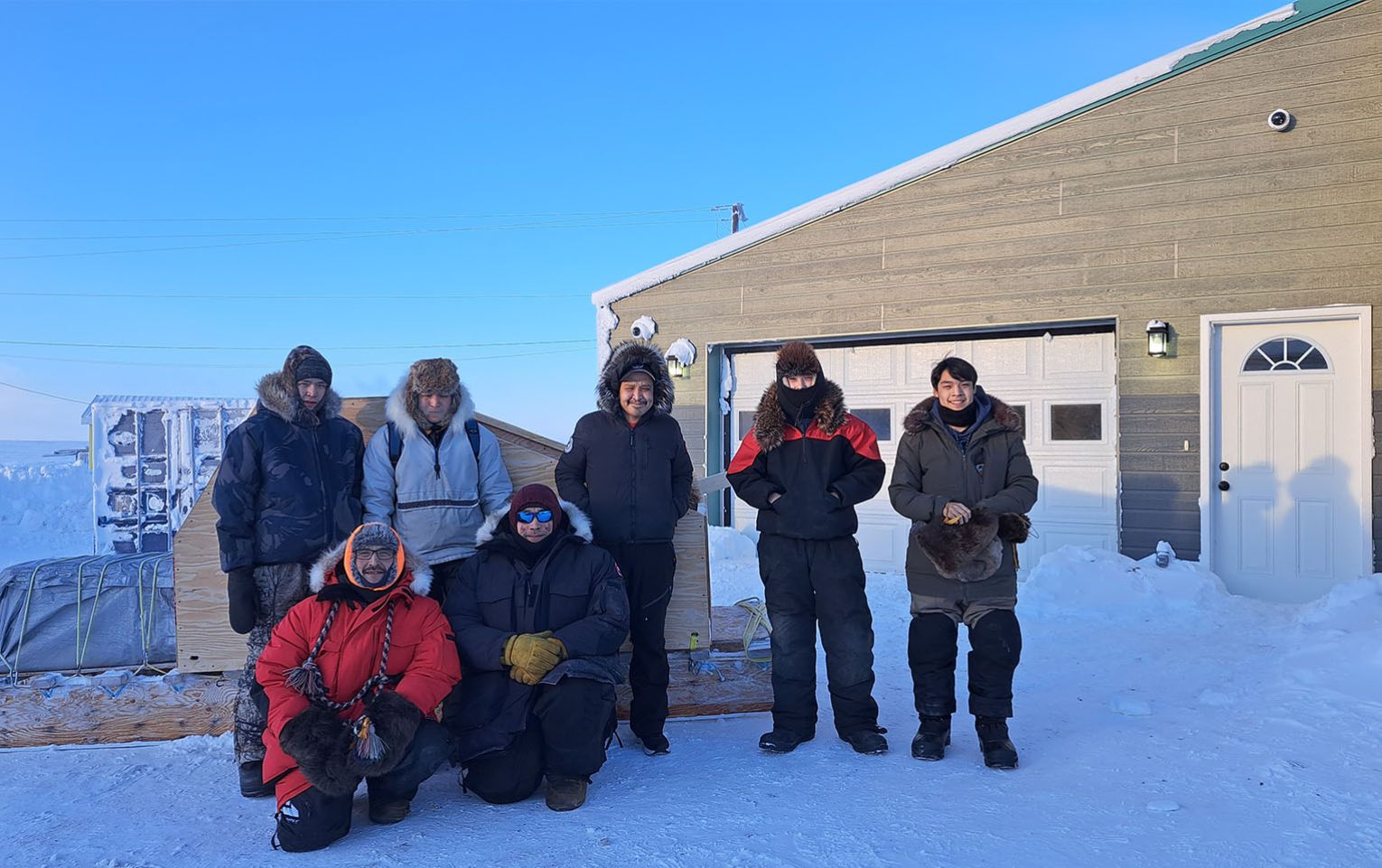 Feb 2023 Ilitaqsiniq On the Land trip. Top, from left: William, Braden, A.J., Brett, and Mackie. Bottom: Bobby and Randy. ""