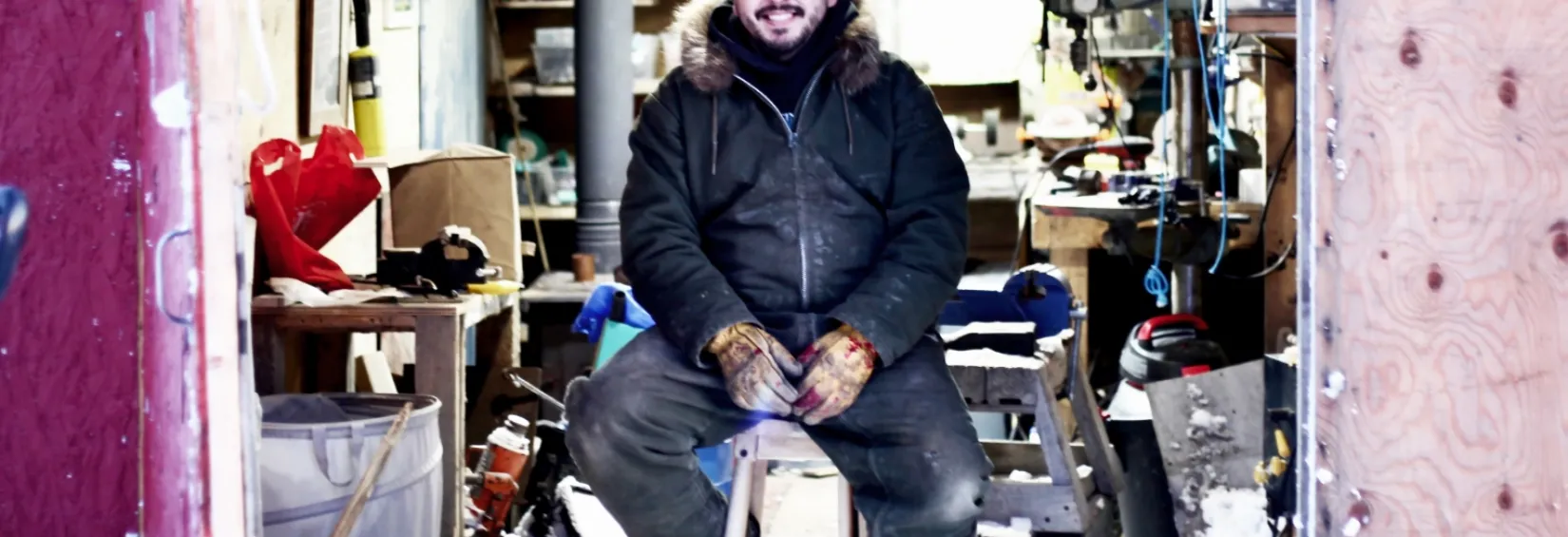Nooks sitting in his workshop in Arviat, Nunavut