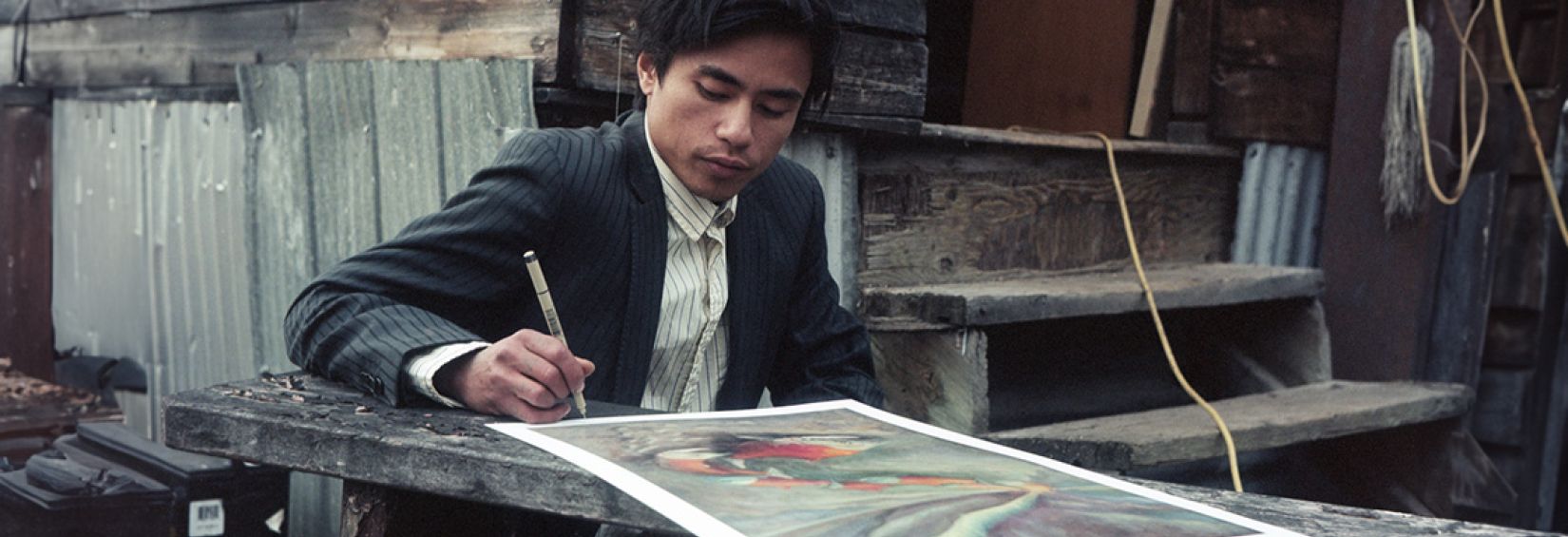 Ramon Joseph Santos signing his artwork, Salmon Aurora - as above, so below. Photography: Justin Apperley Ramon Joseph Santos signing his artwork, Salmon Aurora - as above, so below. Photography: Justin Apperley