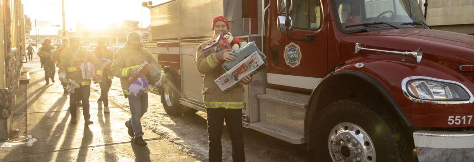 Nick standing in front of a fire truck