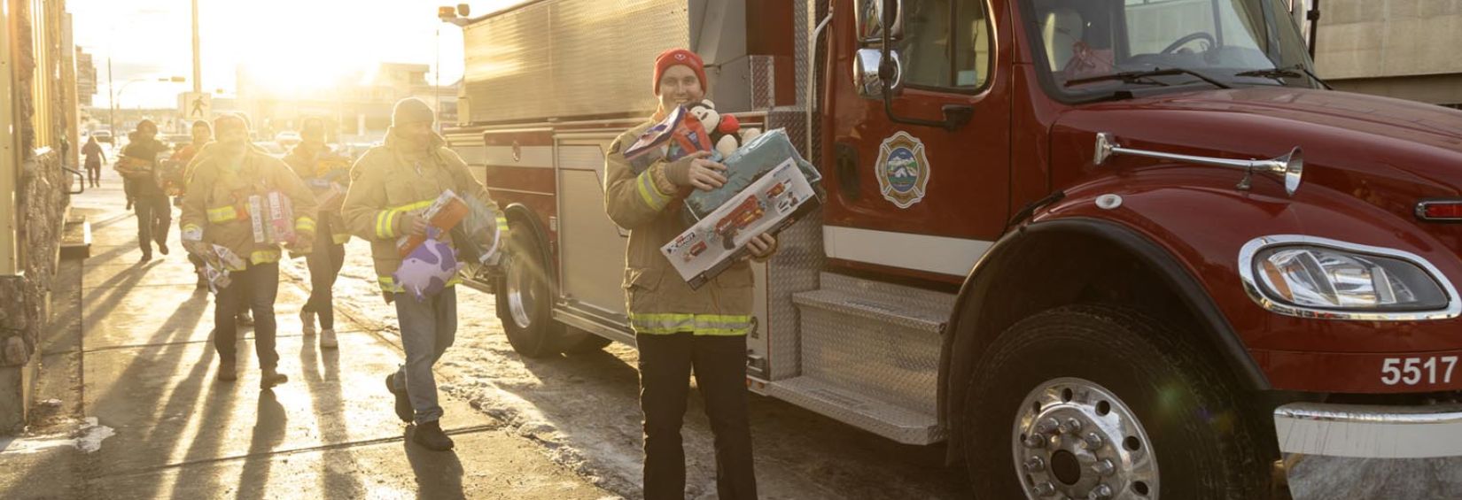 Nick standing in front of a fire truck