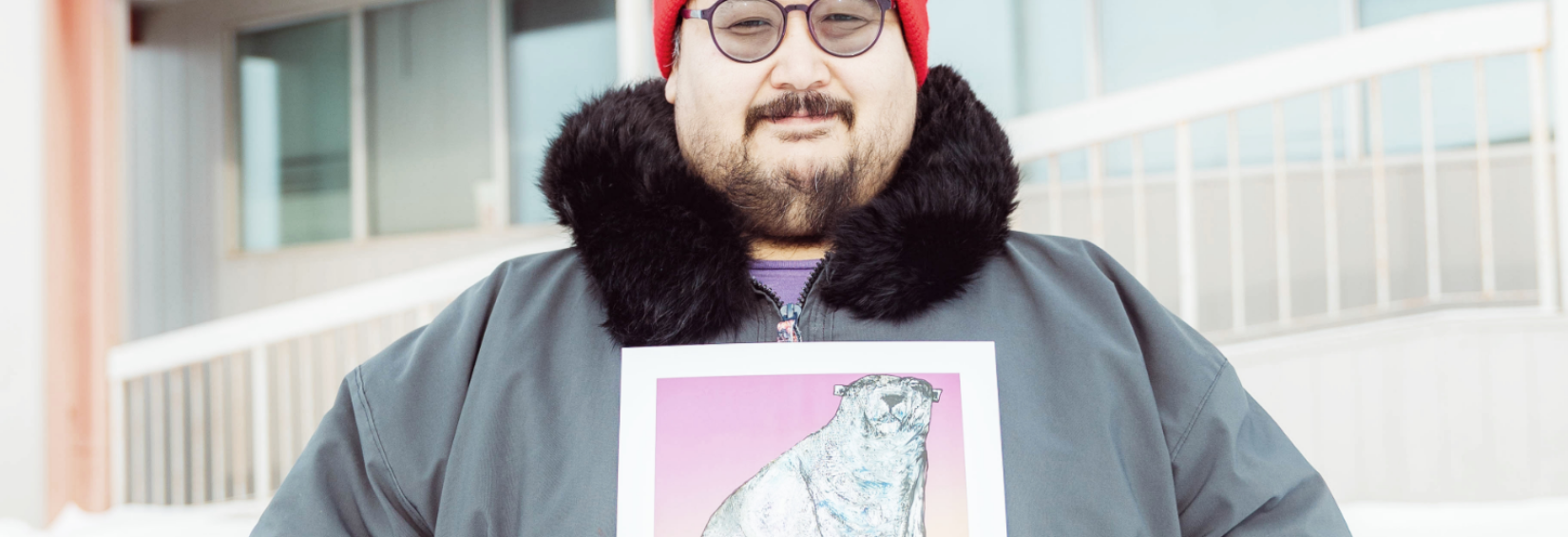 Joshua Qaumariaq holding his artwork - Nanurluk Shapeshifter. Photo by: Natalie Gillis Joshua Qaumariaq holding his artwork - Nanurluk Shapeshifter
