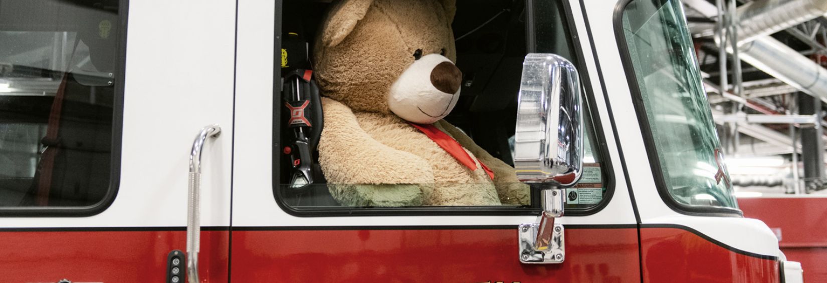 Whitehorse Toy Drive kick-off event Teddy bear in Whitehorse Fire Truck at Toy Drive kick-off event