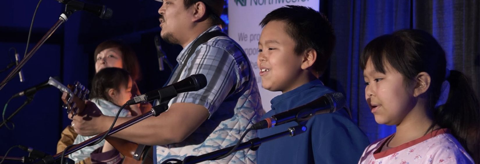 Indigenous singing performance with children singing in choir