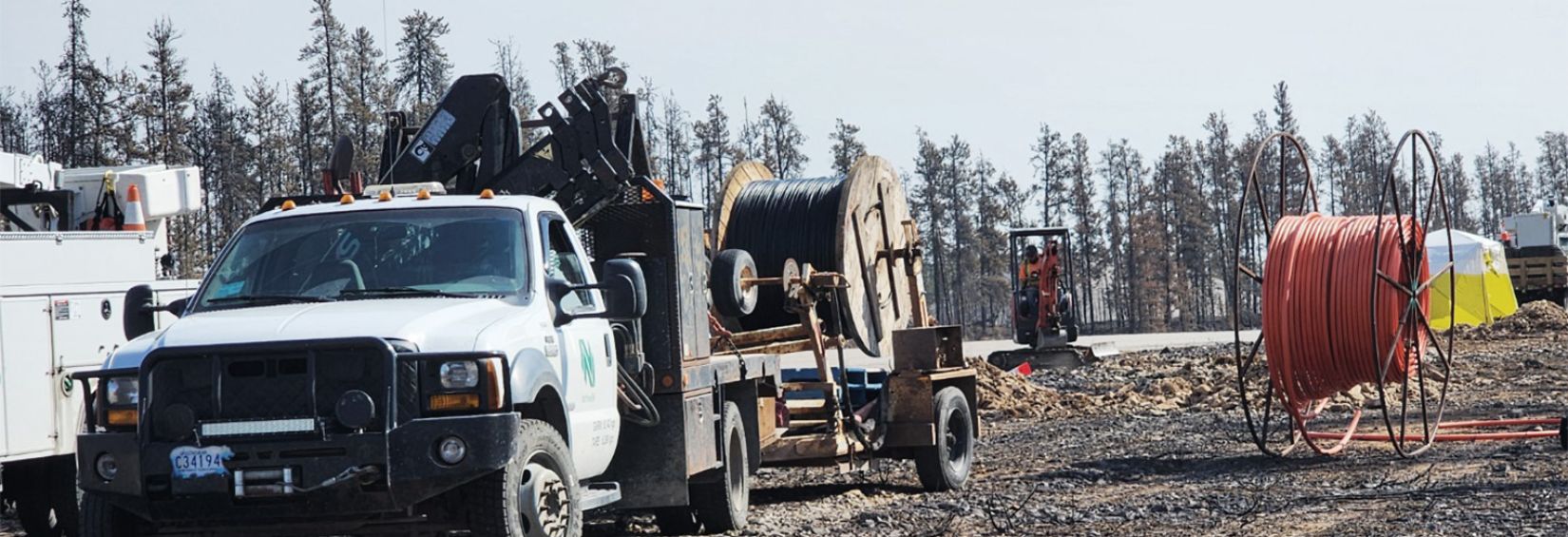 Northwestel technicians working to repair fibre in NWT truck on telecommunication worksite in the NWT