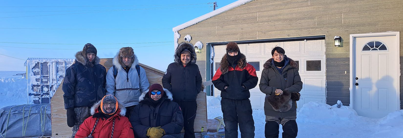 Feb 2023 Ilitaqsiniq On the Land trip. Top, from left: William, Braden, A.J., Brett, and Mackie. Bottom: Bobby and Randy. ""