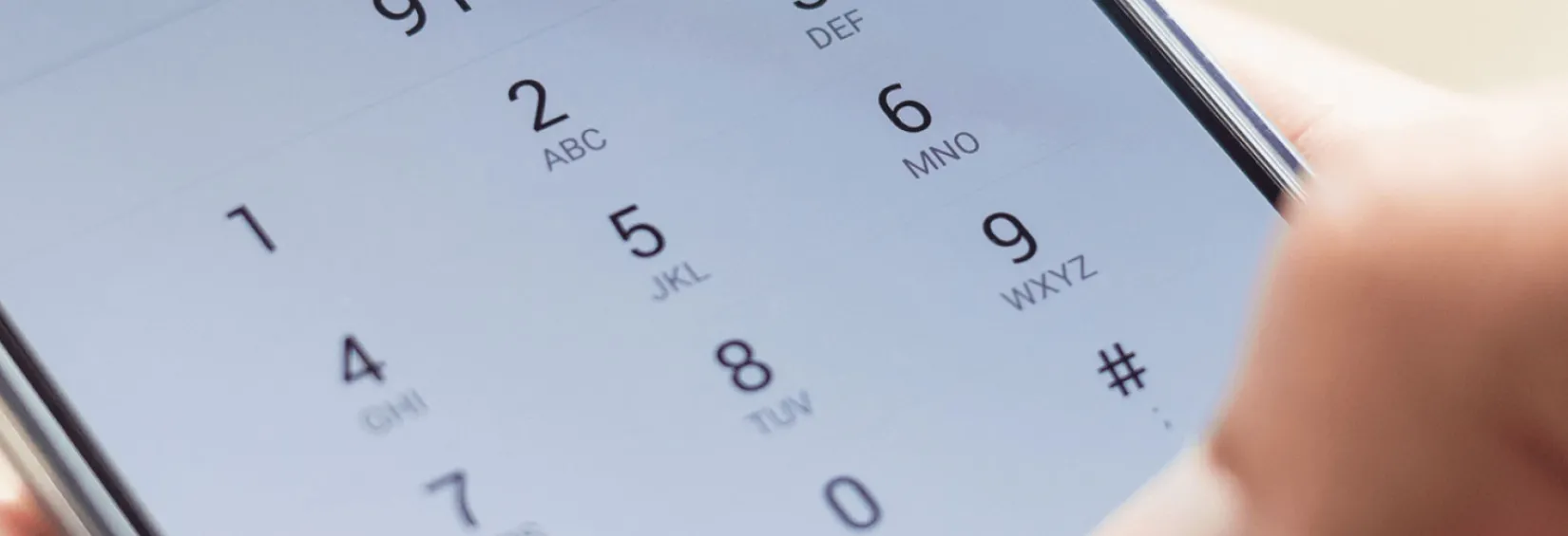 Person dialing 911 on their mobile