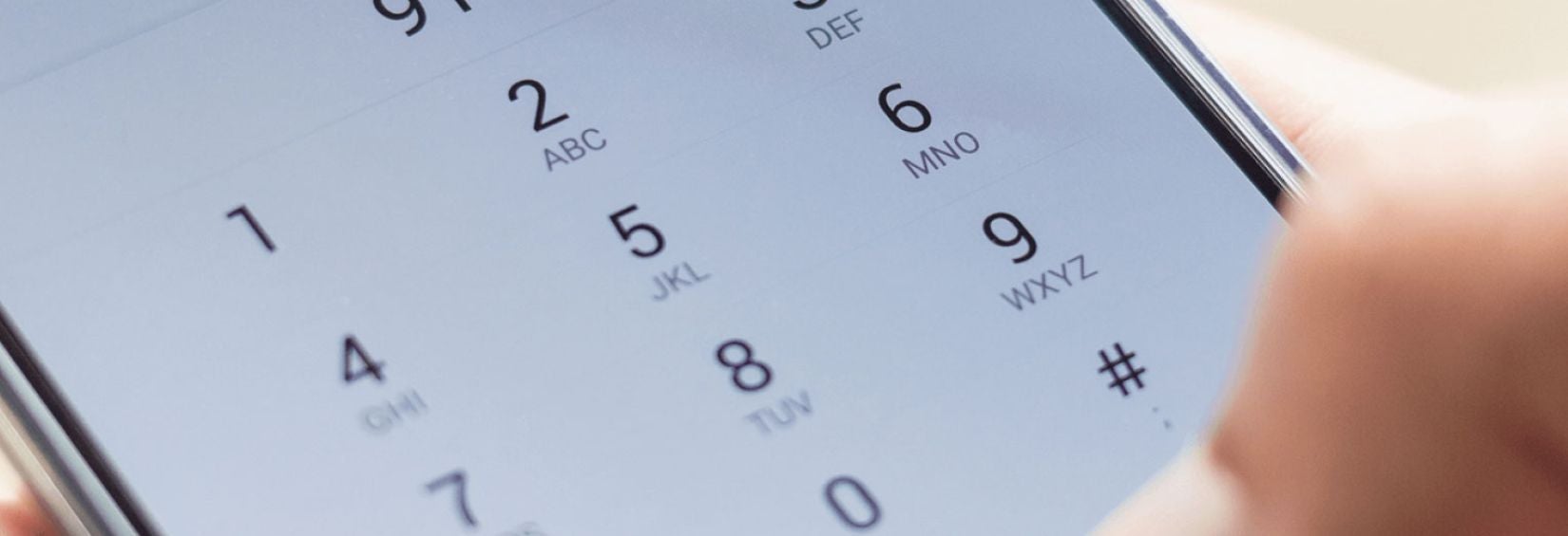 Person dialing 911 on their mobile
