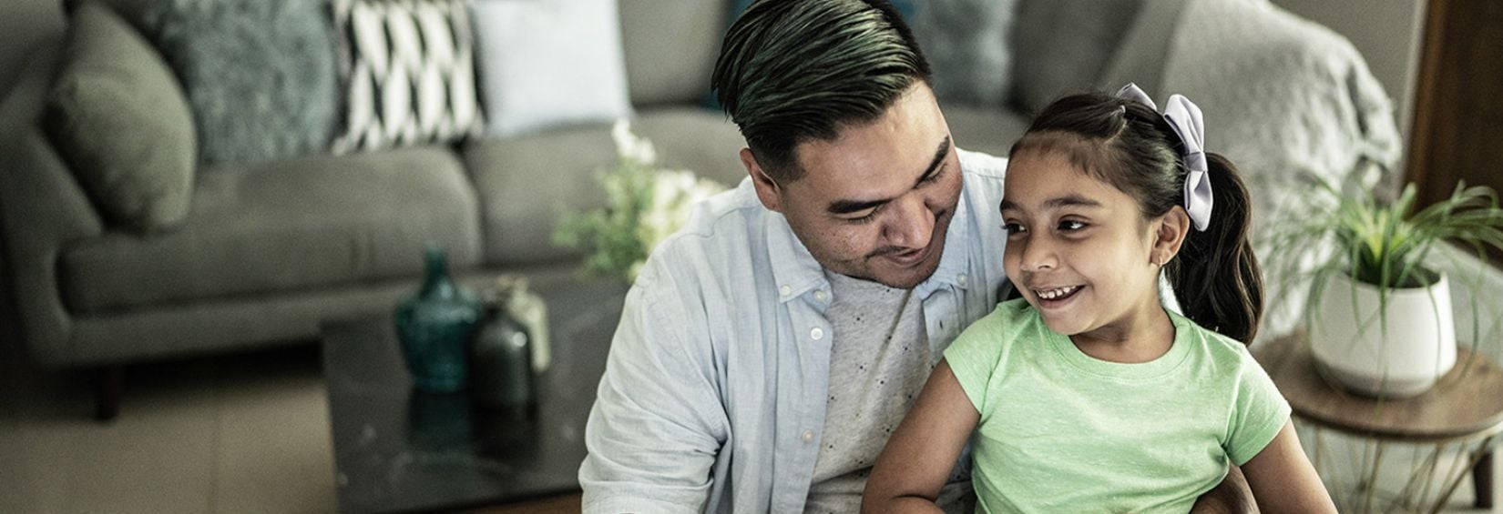 Dad on laptop with daughter