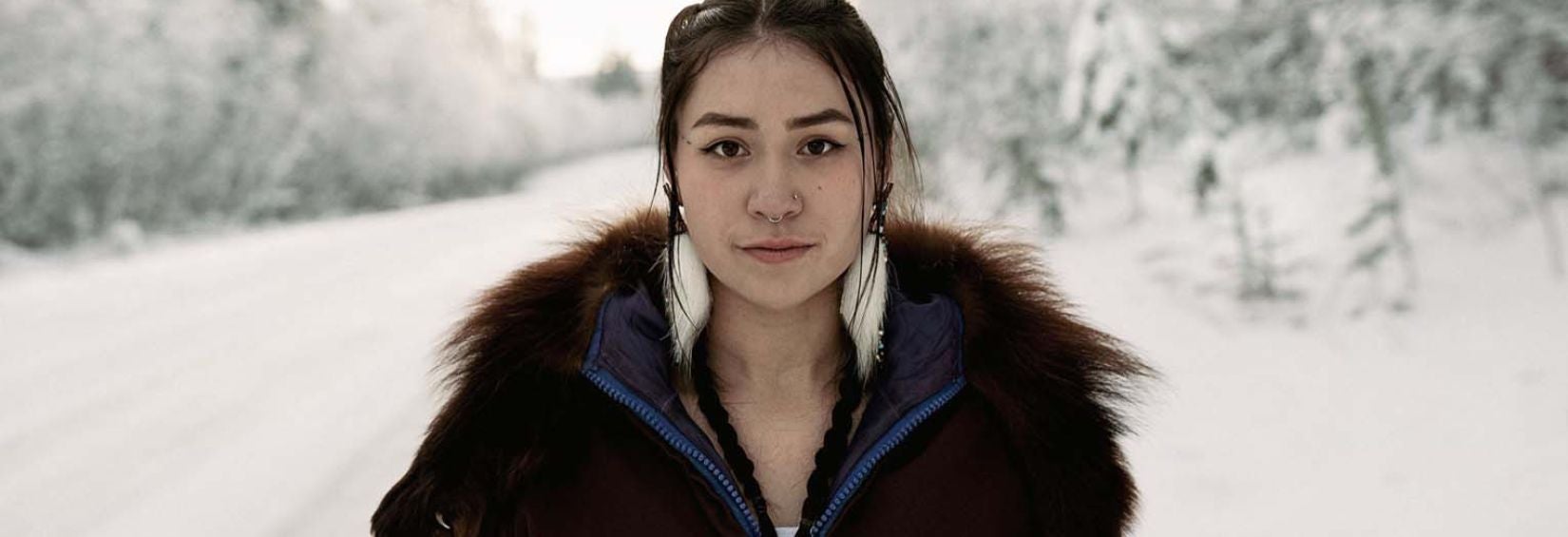 Shania Noksana Woman standing on snowy road