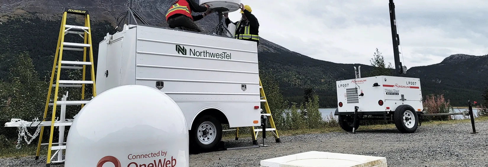 Tech's setting up OneWeb antennae at the Klondike Road Relay OneWeb antenna