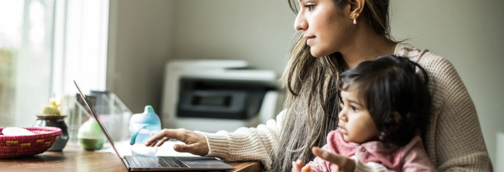 Woman using laptop at home