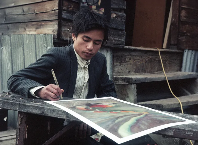 Ramon Joseph Santos signing his artwork, Salmon Aurora - as above, so below. Photography: Justin Apperley Ramon Joseph Santos signing his artwork, Salmon Aurora - as above, so below. Photography: Justin Apperley