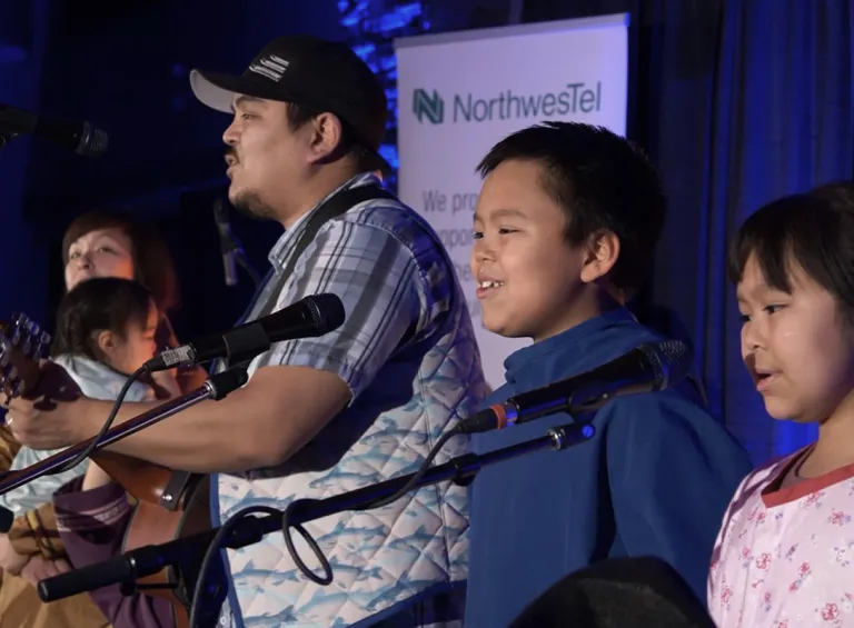 Indigenous singing performance with children singing in choir