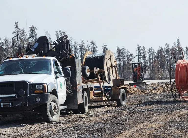 Northwestel technicians working to repair fibre in NWT truck on telecommunication worksite in the NWT