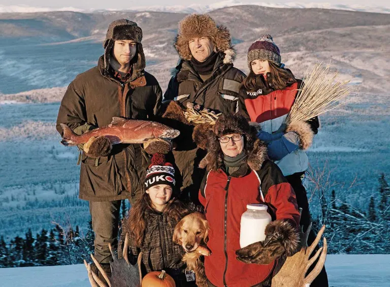 Suzanne Crocker and her family outside on a mountain in winter 
