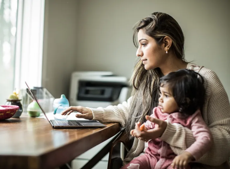 Woman using laptop at home